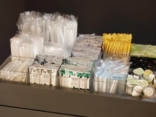 a counter with lots of plastic bags and other items at Smart Place Inn Kyoto Nijojo Horikawa in Kyoto