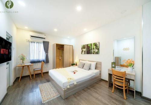 Un ou plusieurs lits dans un hébergement de l'établissement Cactusland Hotel & Apartment