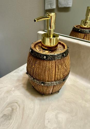 a bathroom sink with a faucet on a counter at Whiskey River Lake Retreat in Taylorsville