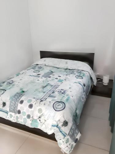 Katil atau katil-katil dalam bilik di Appartement charmant au Tampon de 55 m² avec terrasse
