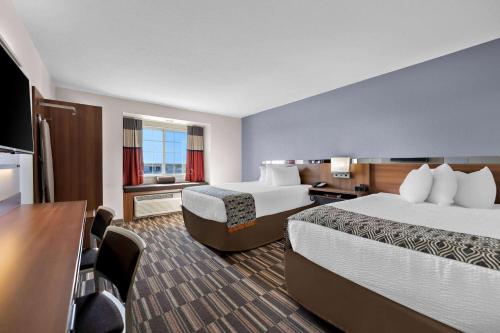 Postel nebo postele na pokoji v ubytování Microtel Inn & Suites by Wyndham Sweetwater