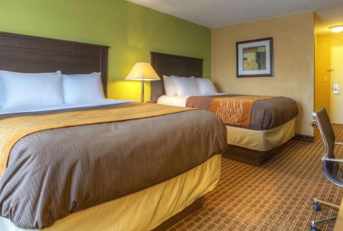 a hotel room with two beds in a room at Quality Inn & Suites Chattanooga-East Ridge in Chattanooga