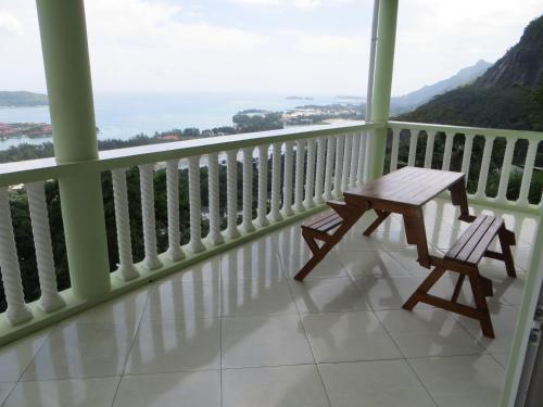 a table and chairs on a balcony with a view at Eden Panoramic in Victoria