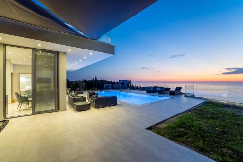 an empty house with a view of the ocean at Zenvillas in Lefkada Town