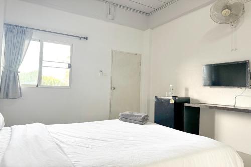 Ένα ή περισσότερα κρεβάτια σε δωμάτιο στο TF Apartment