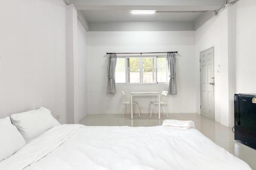 Ένα ή περισσότερα κρεβάτια σε δωμάτιο στο TF Apartment