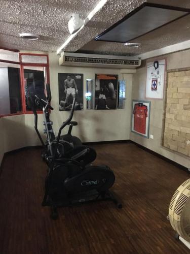 a gym with an exercise bike in a room at Azul Turquesa in Cuernavaca