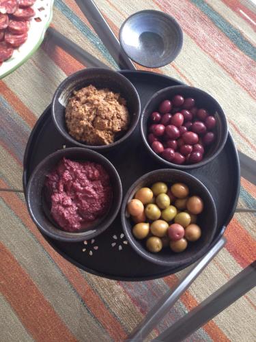 a table with three bowls of different types of food at I Giardini Di Margius in Itri
