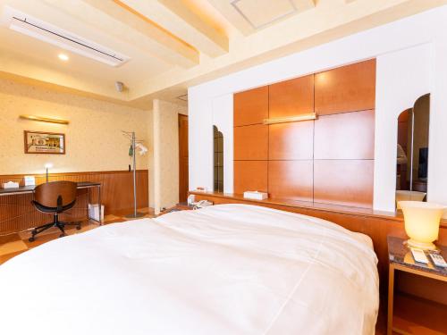 Ein Bett oder Betten in einem Zimmer der Unterkunft Tabist Shizukuishi Resort Hotel