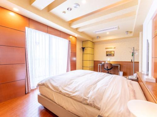 Ein Bett oder Betten in einem Zimmer der Unterkunft Tabist Shizukuishi Resort Hotel