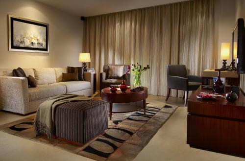 a living room with a couch and a table at Oakwood Residence Shanghai in Shanghai