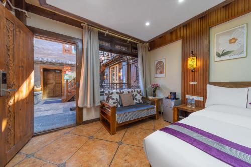 Postel nebo postele na pokoji v ubytování Yingxueke King Room