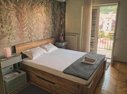 Postel nebo postele na pokoji v ubytování Apartmani SRNA, Igalo