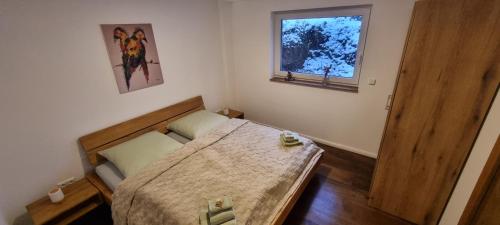 Ένα ή περισσότερα κρεβάτια σε δωμάτιο στο Ferienhaus Q1, Ruhe und Erholung in der Eifel