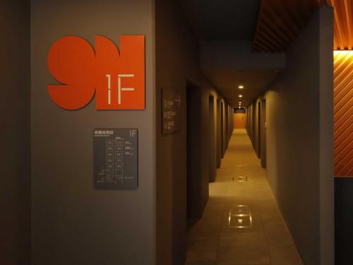 a hallway with an sif sign on a wall at Smart Place Inn Kyoto Shijo Omiya East in Kyoto
