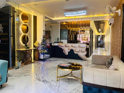 a lobby with a couch and a table at Taj Dream A Luxury Hotel - Agra in Agra
