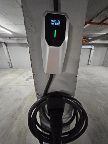 a hose is hooked up to a meter in a parking garage at Sentro Boutique Hotel in Sofia