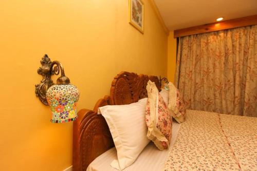 Nandini Villa Dharamshalaにあるベッド