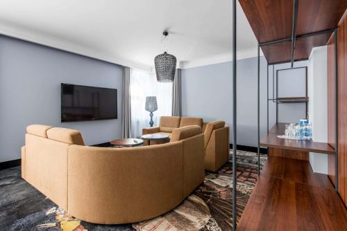TV a/nebo společenská místnost v ubytování Hotel Anders