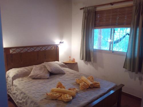 מיטה או מיטות בחדר ב-Monte Capilla