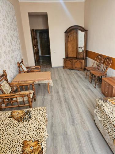 a room with chairs and tables and a mirror at Ayg Hotel and Sport Complex Ararat in Davalinskiy Tsemzavod