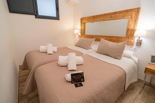 Ένα ή περισσότερα κρεβάτια σε δωμάτιο στο Center Suites San Eloy