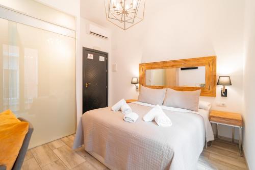 Ένα ή περισσότερα κρεβάτια σε δωμάτιο στο Center Suites San Eloy