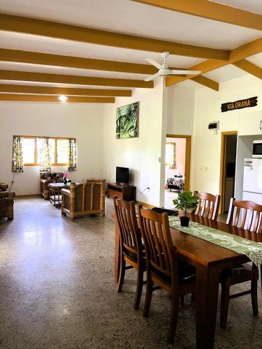 a dining room with a table and chairs at Muri Homeland Villa in Rarotonga