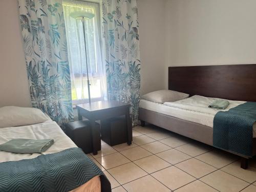 Posteľ alebo postele v izbe v ubytovaní Motel w Łące