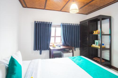Postel nebo postele na pokoji v ubytování Adora Bay Ke Ga Beach Resort