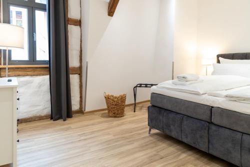 Katil atau katil-katil dalam bilik di Schiefer Suite Hotel & Apartments