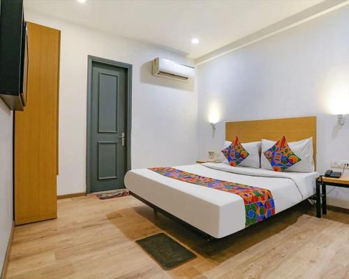 Postel nebo postele na pokoji v ubytování Hotel Fab Green Inn