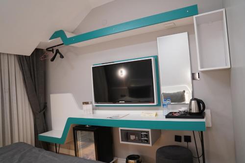 TV a/nebo společenská místnost v ubytování Midis Otel
