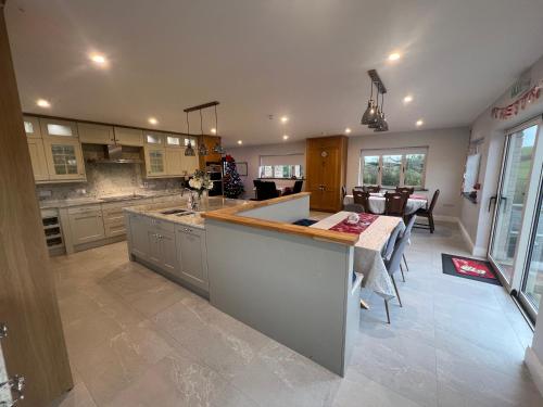 a large kitchen with a island in the middle at Willow Valley in Monaghan