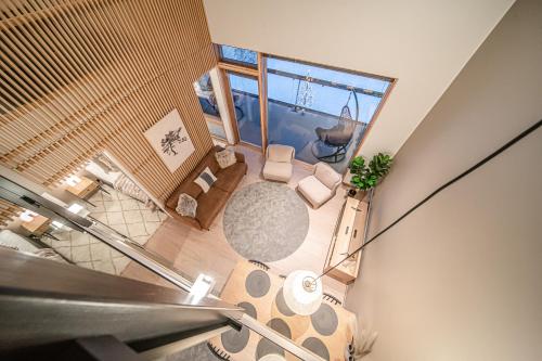 an overhead view of a living room with a view of a room at Horizon Chalet by Aavalevi Holidays, Ski-in Ski-out, Mountain view in Levi