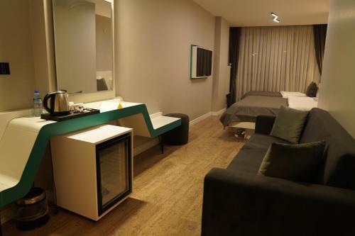 Postel nebo postele na pokoji v ubytování Midis Otel