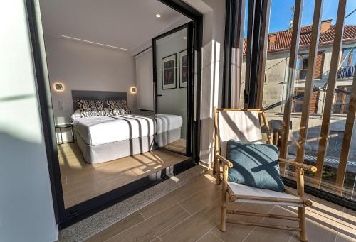 Postel nebo postele na pokoji v ubytování GALIHOST - Apartamentos Carmucha y Benito
