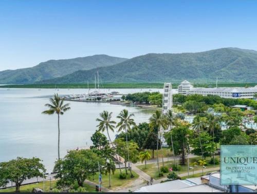 a view of a body of water with palm trees at Studio room in Cairns Esplanade! Ocean view! Heart of Cairns in Cairns