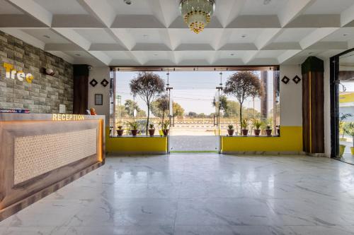 a lobby with a volleyball net in a building at Lime Tree Hotel and Banquet Vrindavan in Vrindāvan