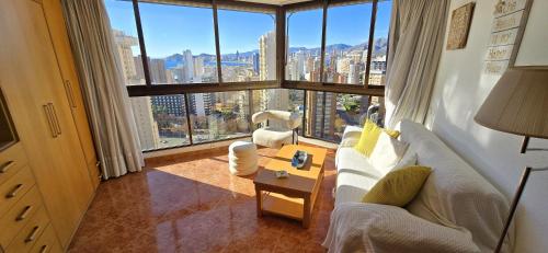 a living room with a view of a city at Edificio Torpa in Benidorm