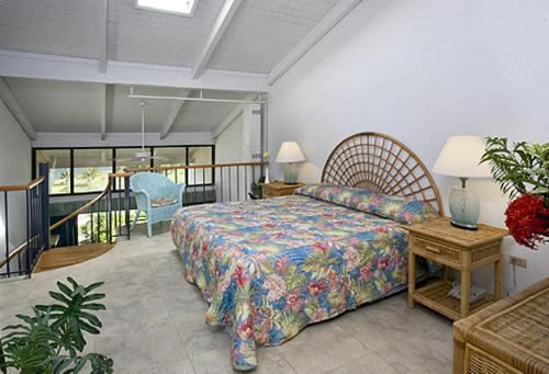 A bed or beds in a room at Club St. Croix Beach and Tennis Resort