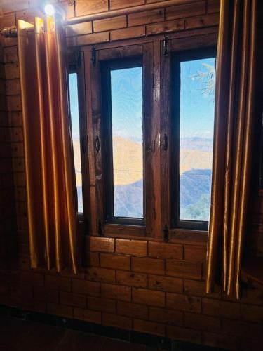 a window in a room with a view of the desert at Hotel Himalayan View in Chakrāta