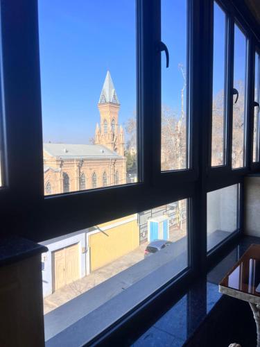a view of a church from a window at RIO Hotel in Samarkand
