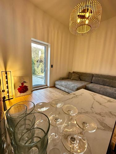 a living room with wine glasses on a table at Bright and Modern Loft Retreat in Kehl am Rhein