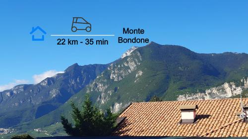 a view of a mountain with a house and a roof at Over the Castle Apartment in Trento