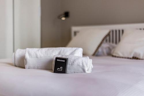 Кровать или кровати в номере Le Chalet climatisé du 6ème