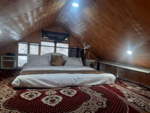 Postel nebo postele na pokoji v ubytování Matri Pitri Cottage