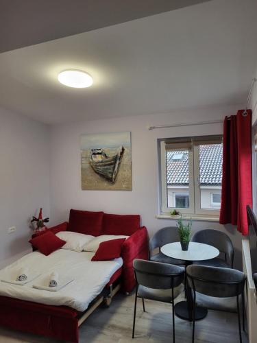 a living room with a bed and a table at Villa Vino & Grad in Zagreb