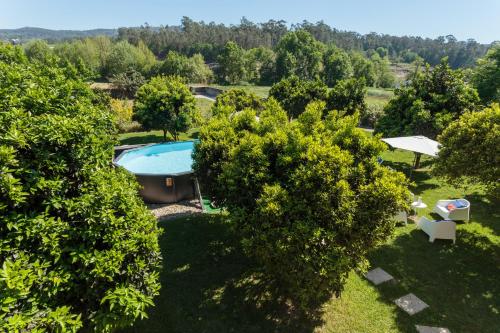 an aerial view of a garden with a swimming pool at Quinta Santo António Amares in Amares