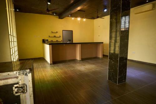 an empty office with a desk in a room at AMP Lodge in Kumasi